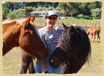 Click to enlarge. Riding in the vineyard during a learning vacation with the Equine Research Foundation.